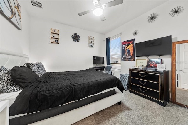 carpeted bedroom featuring ceiling fan and visible vents