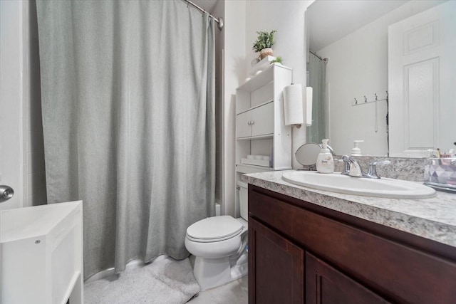 bathroom with shower / tub combo, vanity, and toilet