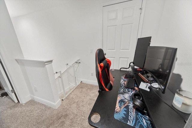 office area with light carpet and baseboards