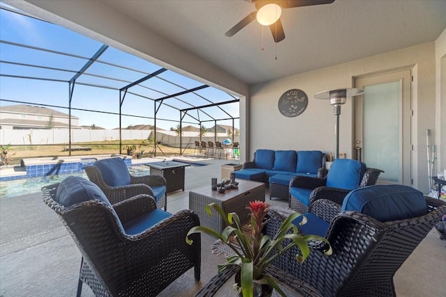 view of patio featuring ceiling fan, a lanai, an outdoor living space, and a fenced in pool