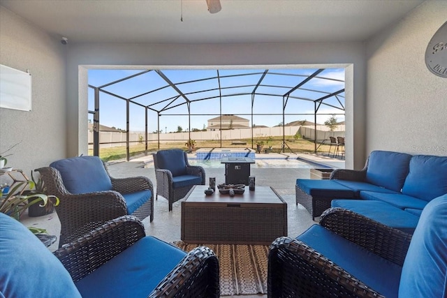 view of patio / terrace with an outdoor hangout area, a lanai, and a ceiling fan