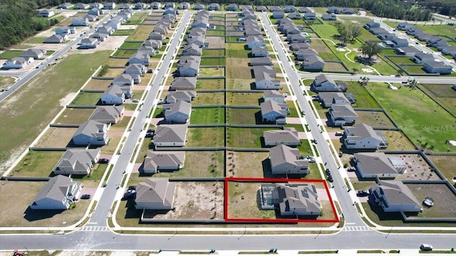 birds eye view of property with a residential view