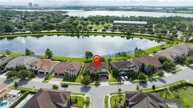 birds eye view of property with a water view