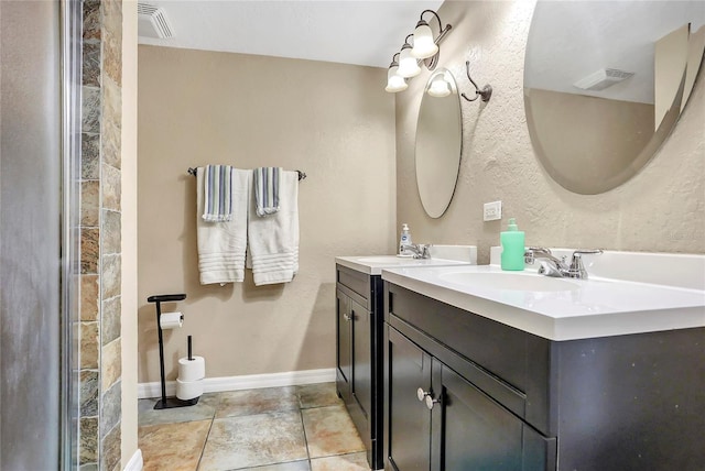 full bath featuring visible vents, a sink, baseboards, and double vanity