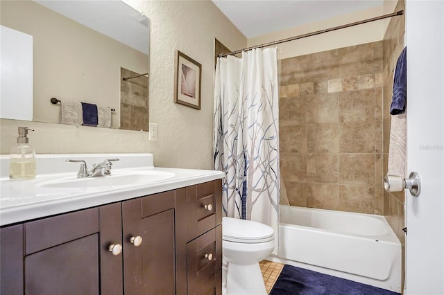 bathroom with toilet, a textured wall, shower / bath combo, and vanity