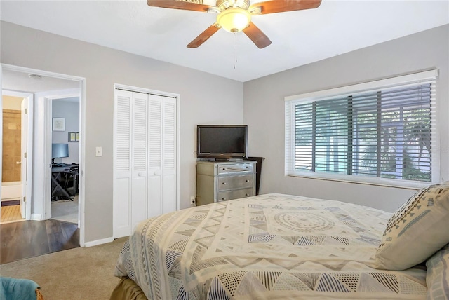 bedroom with a closet, baseboards, carpet, and a ceiling fan