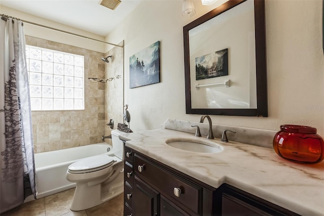 full bathroom featuring vanity, toilet, tile patterned floors, and shower / bath combo with shower curtain