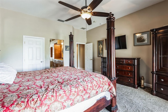 carpeted bedroom with ceiling fan and vaulted ceiling