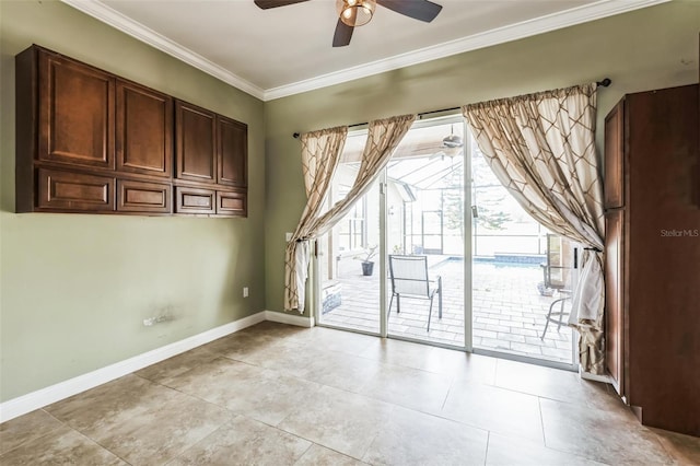 empty room with ceiling fan, ornamental molding, and light tile patterned flooring