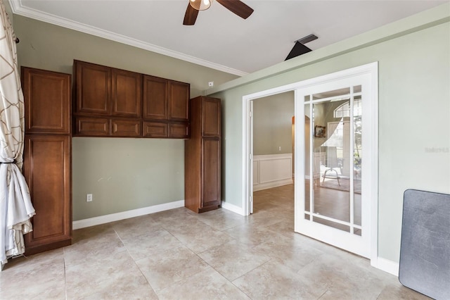 unfurnished bedroom with ceiling fan and ornamental molding