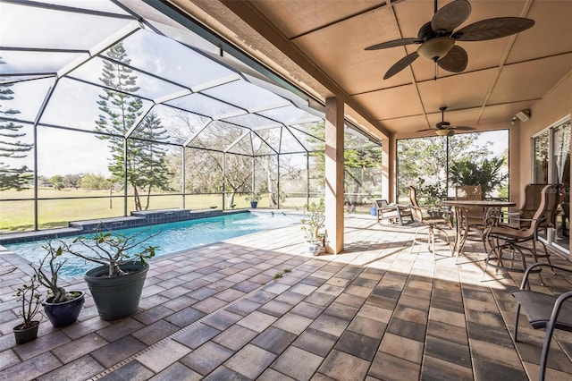 view of patio / terrace with glass enclosure and ceiling fan