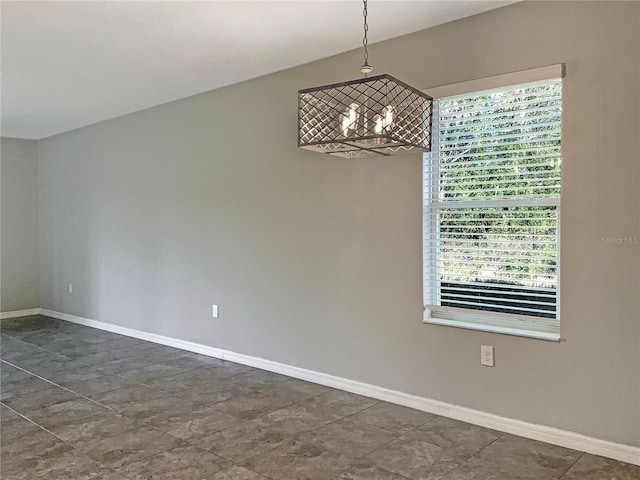 empty room featuring baseboards