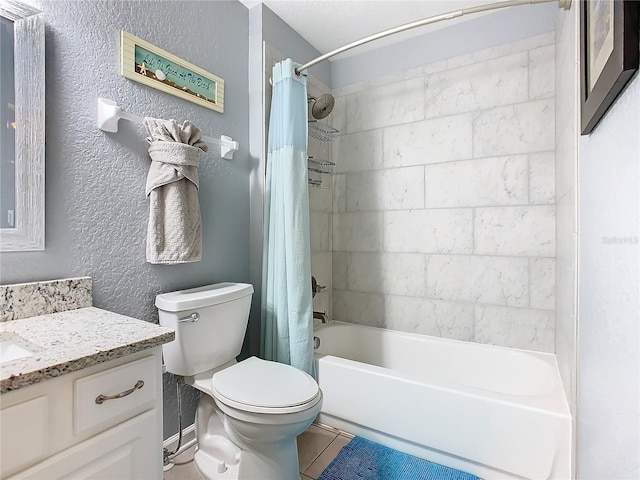 full bathroom with a textured wall, shower / tub combo with curtain, vanity, and toilet