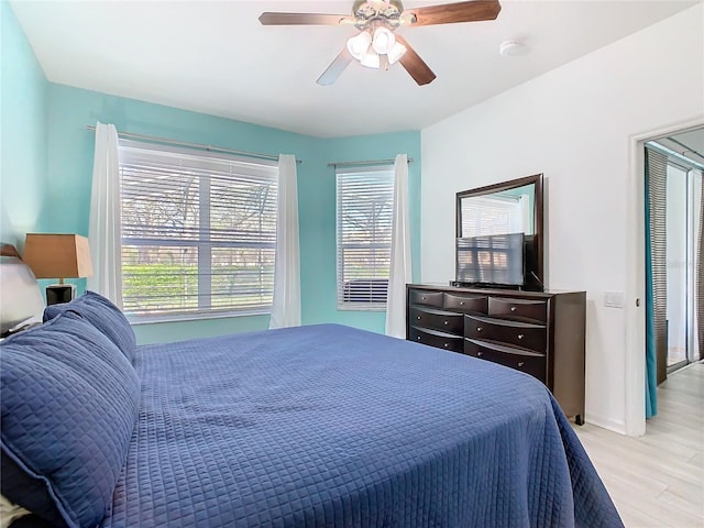 bedroom featuring light wood-style floors and ceiling fan