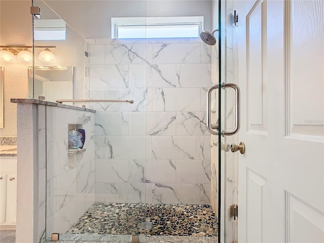 bathroom featuring a shower stall