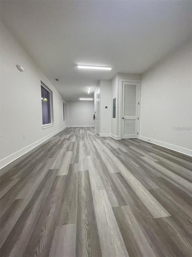 empty room with hardwood / wood-style flooring