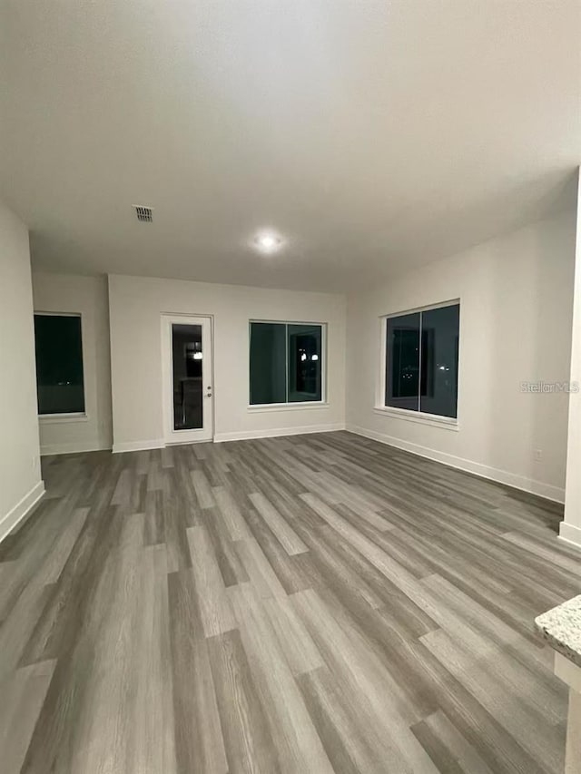 unfurnished living room featuring light hardwood / wood-style flooring