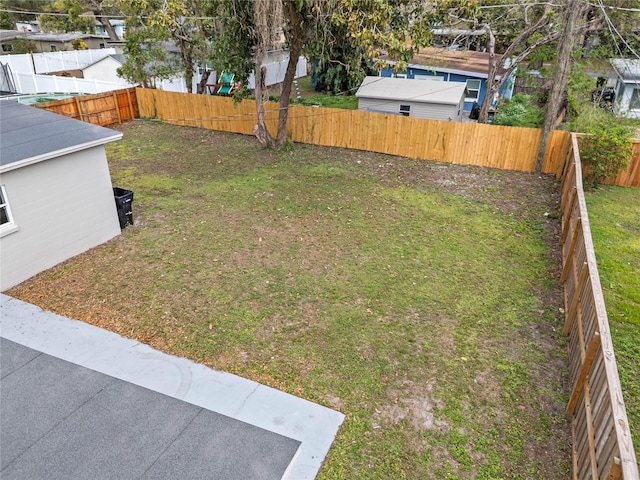 view of yard featuring a fenced backyard and a patio