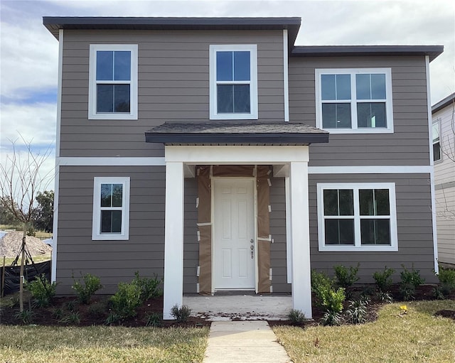 view of front of house with a front lawn