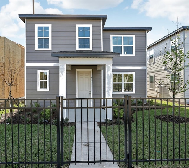 view of front of house with a fenced front yard and a gate