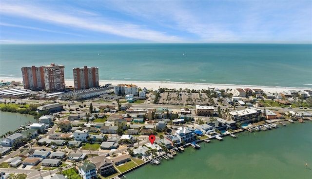 aerial view with a beach view, a water view, and a city view