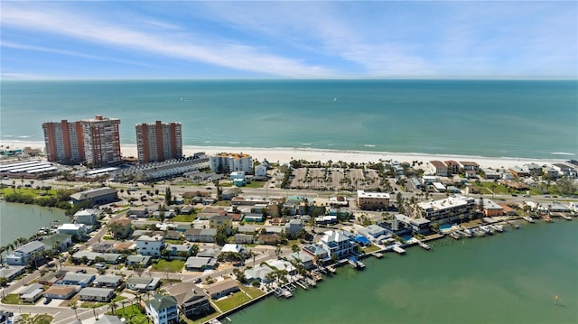 bird's eye view featuring a view of city, a water view, and a beach view