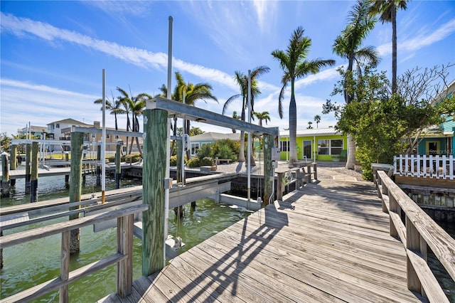 view of dock featuring a water view and boat lift