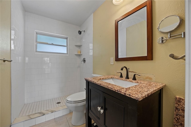 full bath featuring toilet, tile patterned floors, a shower stall, and vanity