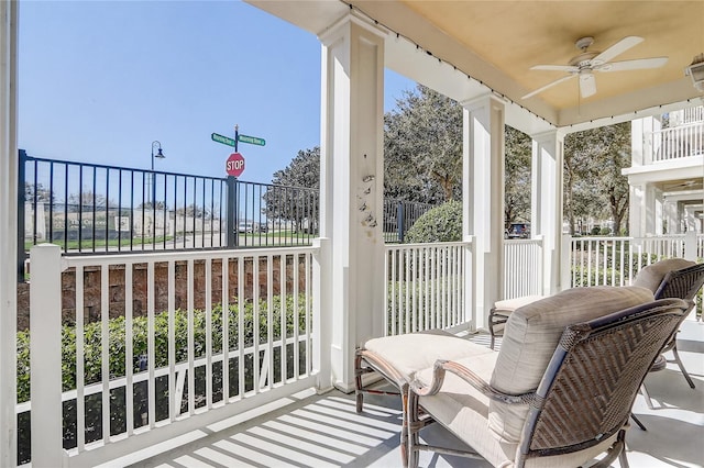 exterior space with ceiling fan