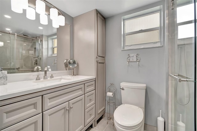 bathroom featuring toilet, vanity, and walk in shower