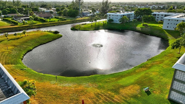 birds eye view of property with a water view