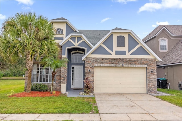 view of front of home with a front lawn and a garage