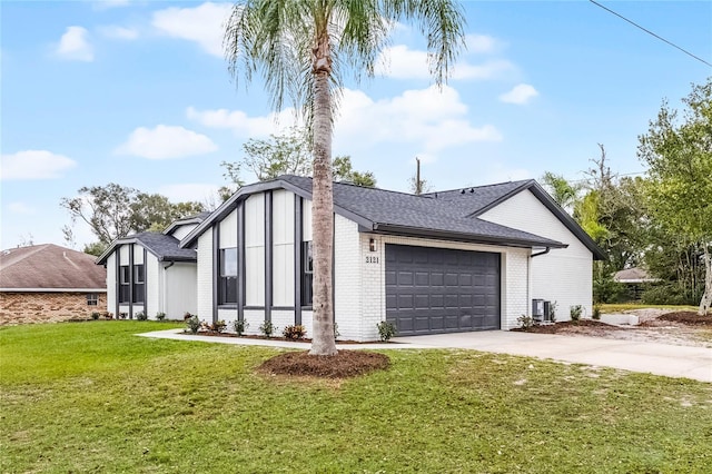 exterior space featuring brick siding, roof with shingles, an attached garage, a front yard, and driveway