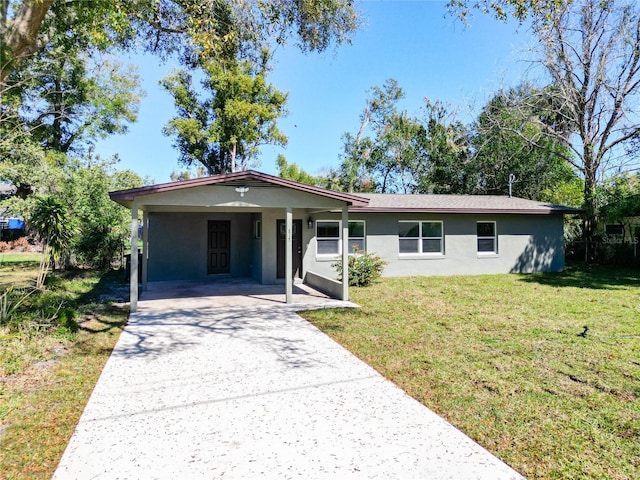 ranch-style house with a front lawn and a carport