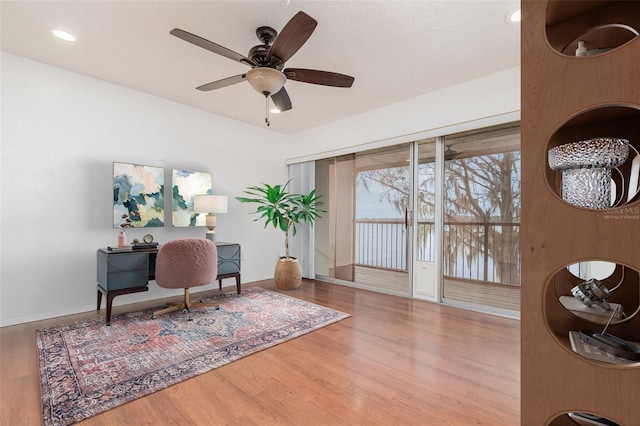 office with a ceiling fan, recessed lighting, baseboards, and wood finished floors