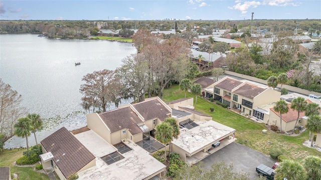 birds eye view of property featuring a water view and a residential view