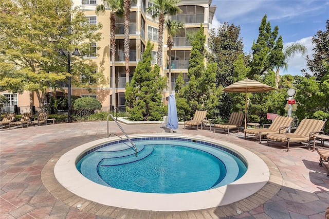 view of swimming pool featuring a patio