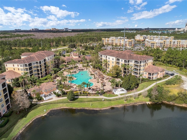 birds eye view of property with a water view