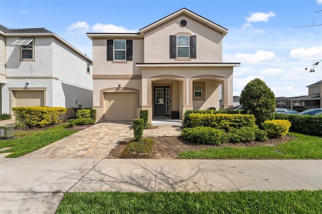 view of front of property with a garage