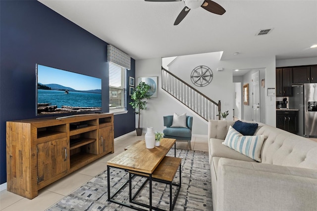 tiled living room featuring ceiling fan