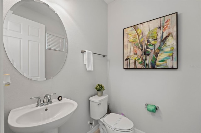 bathroom with sink and toilet