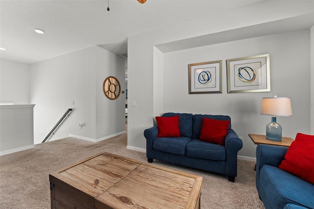 carpeted living room featuring a baseboard heating unit