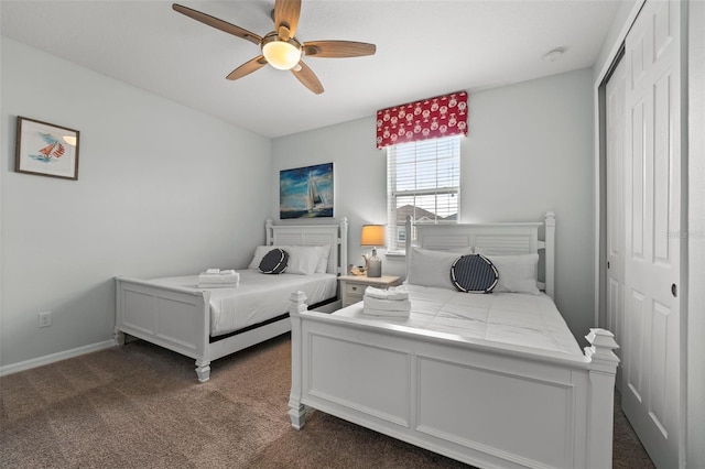 carpeted bedroom with a closet and ceiling fan