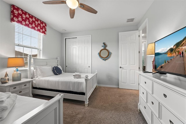 carpeted bedroom featuring a closet and ceiling fan