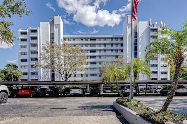 view of building exterior with covered parking