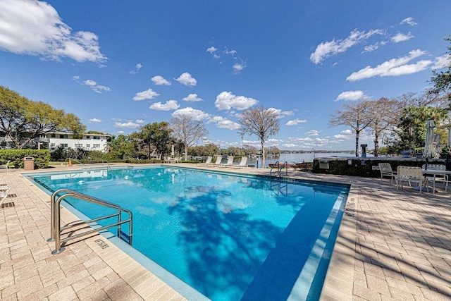 community pool featuring a patio area