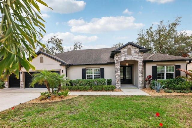 view of front of house with a front lawn and a garage