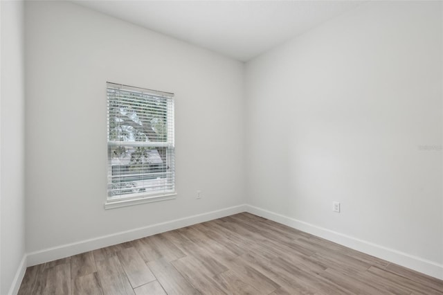 unfurnished room featuring light hardwood / wood-style floors