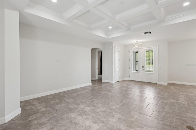 spare room featuring coffered ceiling, french doors, beamed ceiling, and crown molding