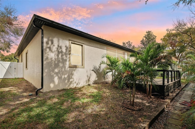 view of property exterior at dusk